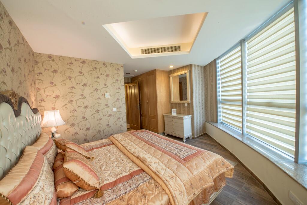 Luxurious Centaurus Apartments Islamabad, this bedroom features a spacious bed.