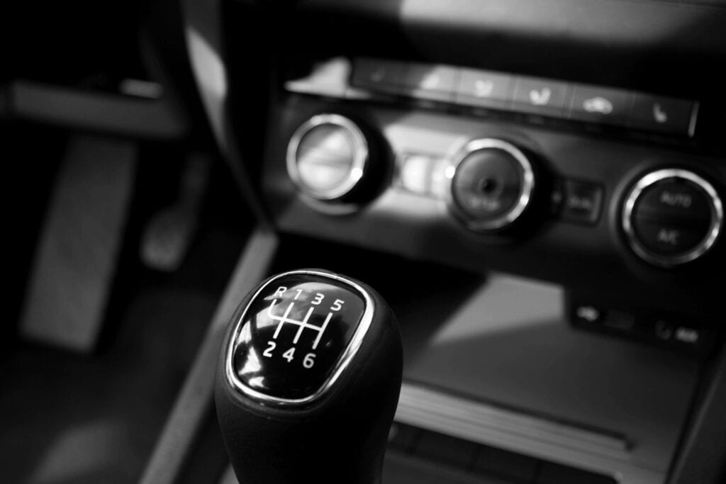 A black and white photo of a gear shift in a car.