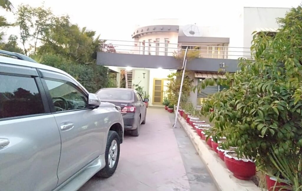 A car is parked in front of a house.