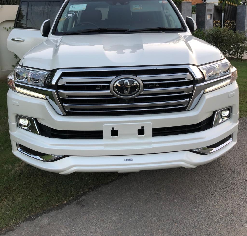 Front view of a white Toyota Land Cruiser.