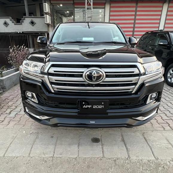Black Toyota Land Cruiser parked on street.
