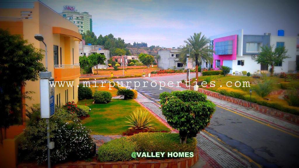 A street in a residential area with colorful buildings in Azad Kashmir.