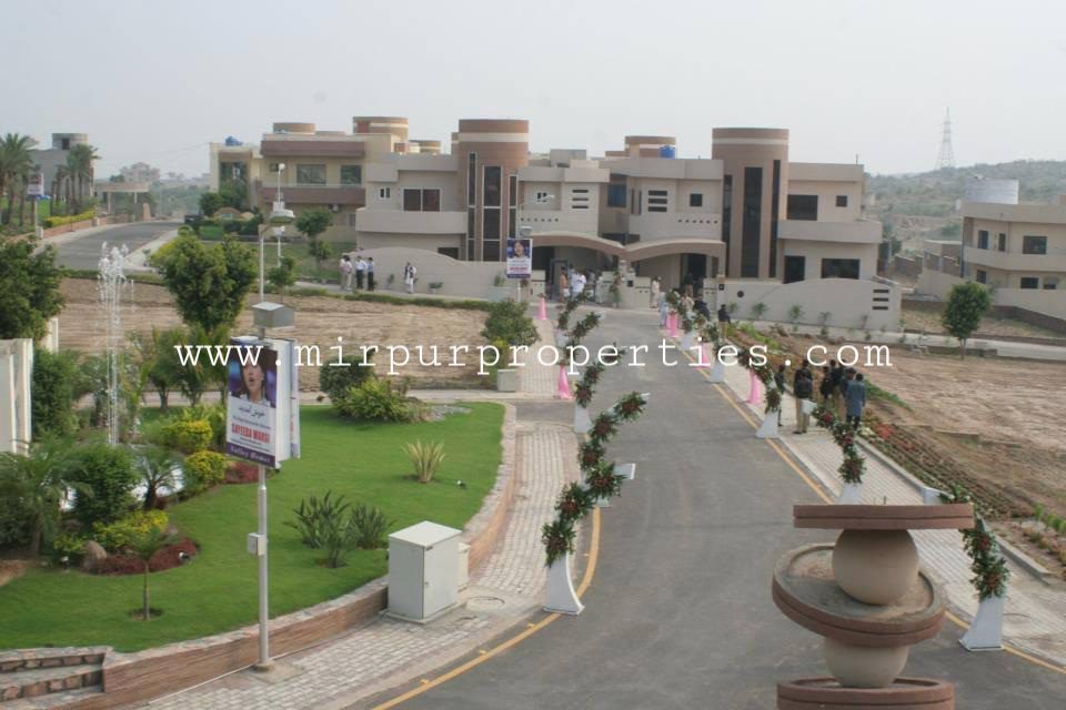 A view of Valley Homes with lawns and trees.