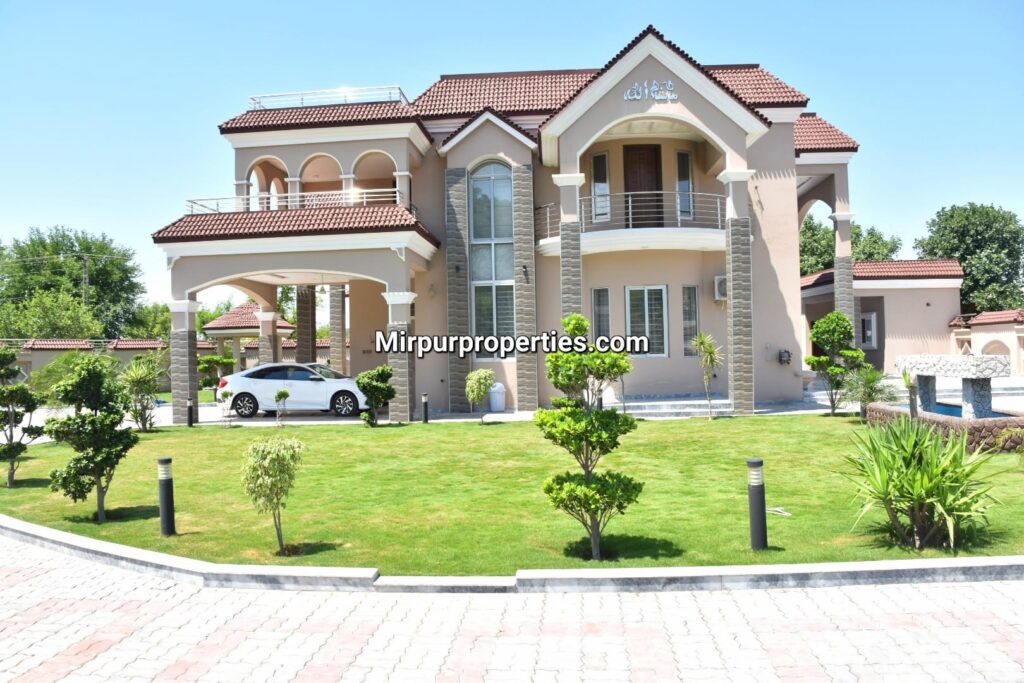 Aziz Villa, located on Mirpur Road, is a spacious house with a car parked in front of it.