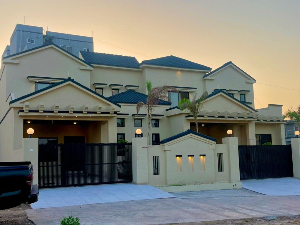 A house with a driveway and a car in front of it, located in Sector D4 Mirpur.